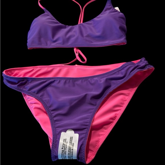 A No Boundries bikini that is reversible and can be pink or purple or a combo - Picture 3 of 10